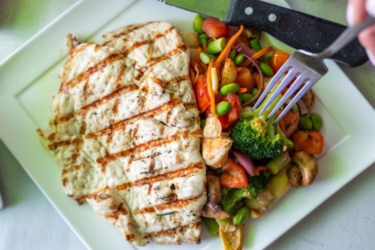 thinly pounded grilled chicken breast, extra virgin olive oil, sauteed garlic rainbow mixed vegetables